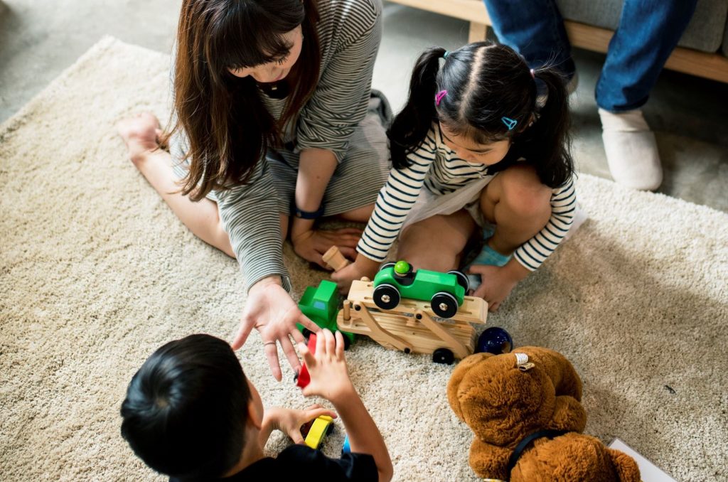 Social Coaching Through Child-Directed Play